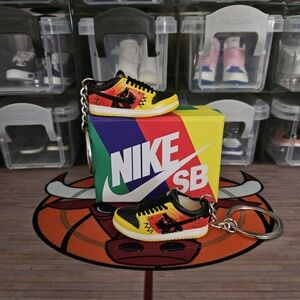 Nike SB pair of mini sneakers keychain.